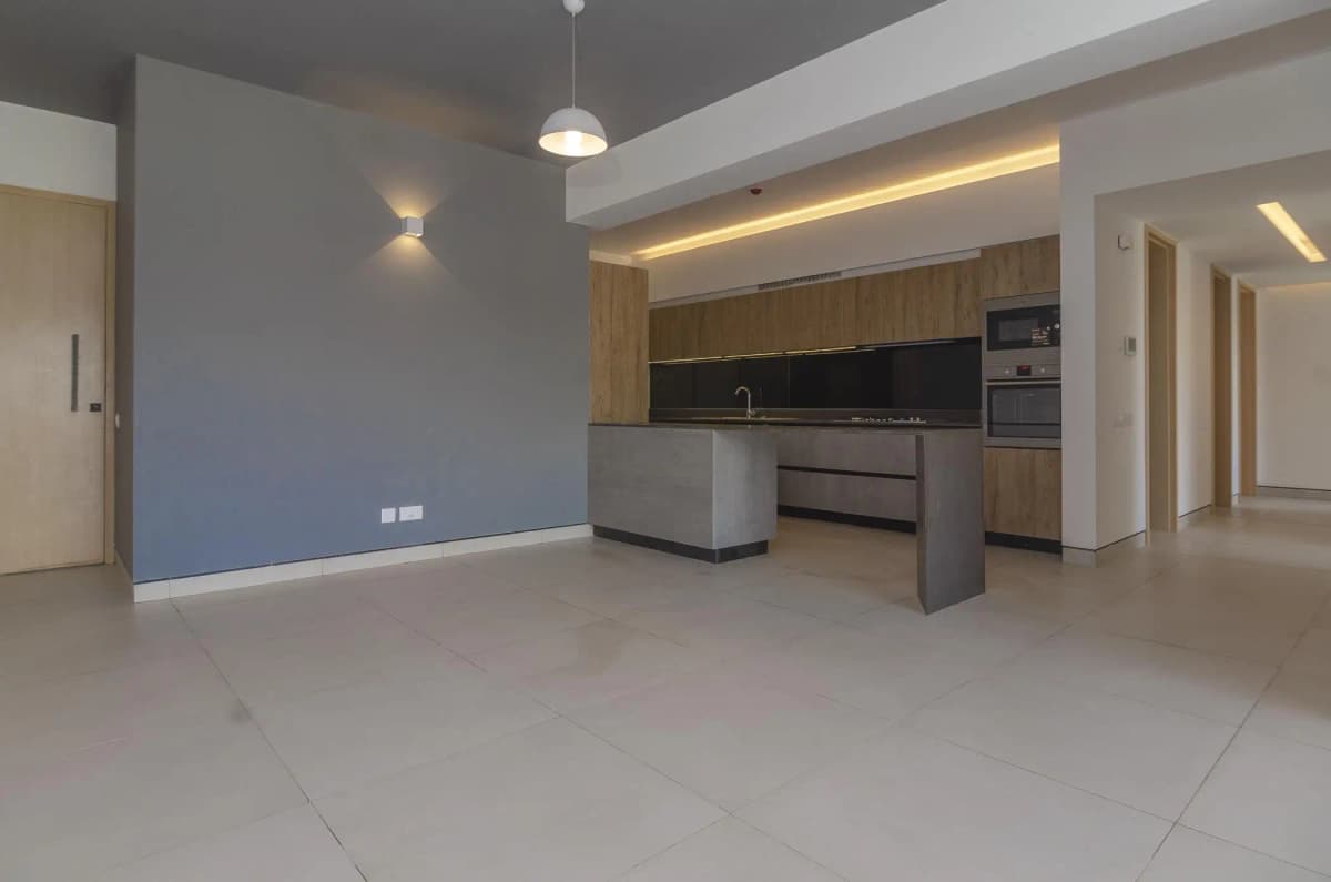 Open-plan living and kitchen with modern finishes and LED lighting