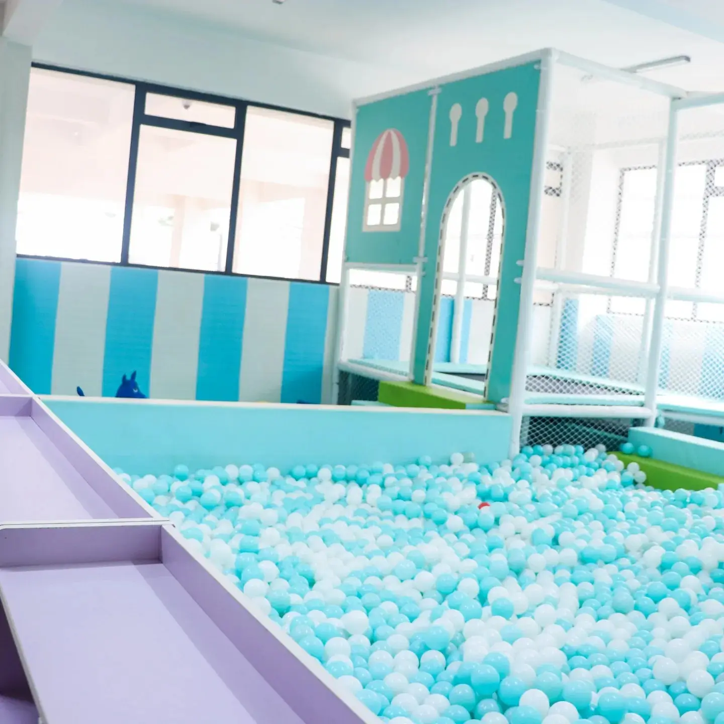 Children's play area with ball pit and colorful themed decor