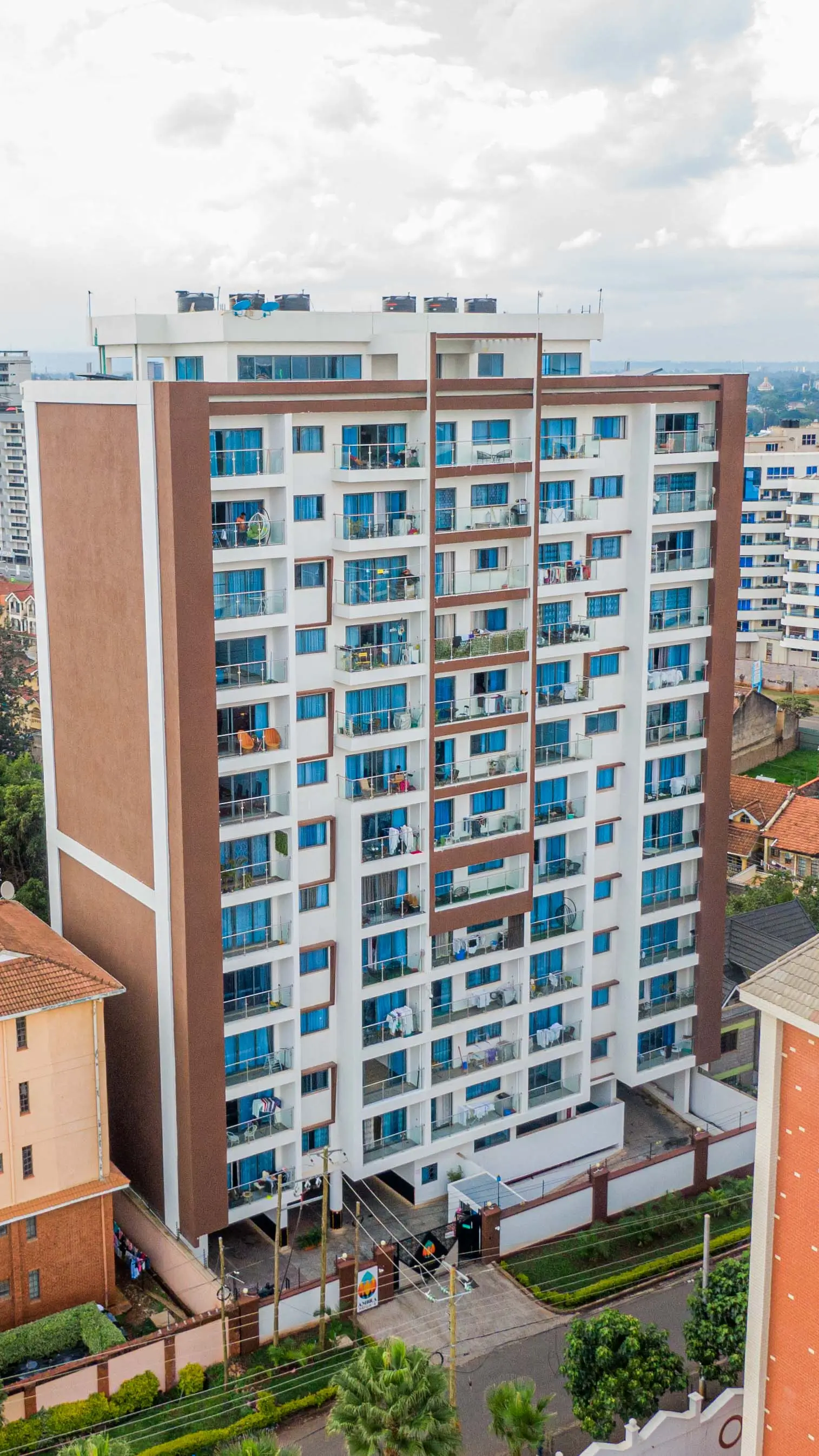 Multi-story residential building with blue-accented facade