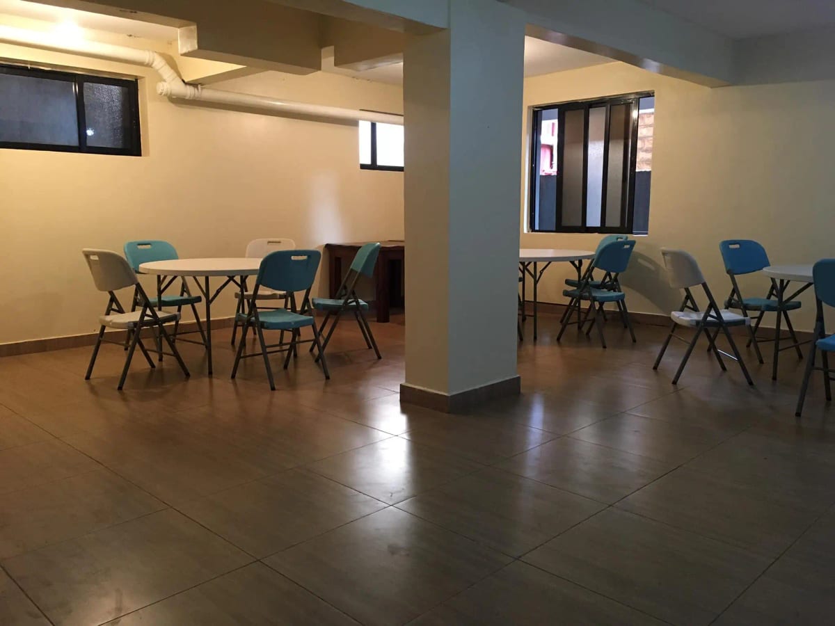 Spacious lobby with seating areas and central support column