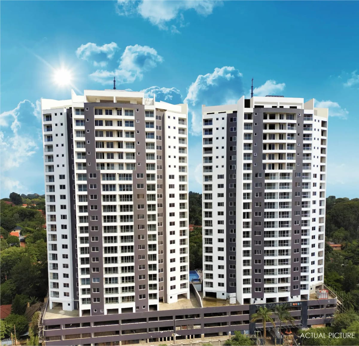 Modern multi-story residential apartment complex with parking