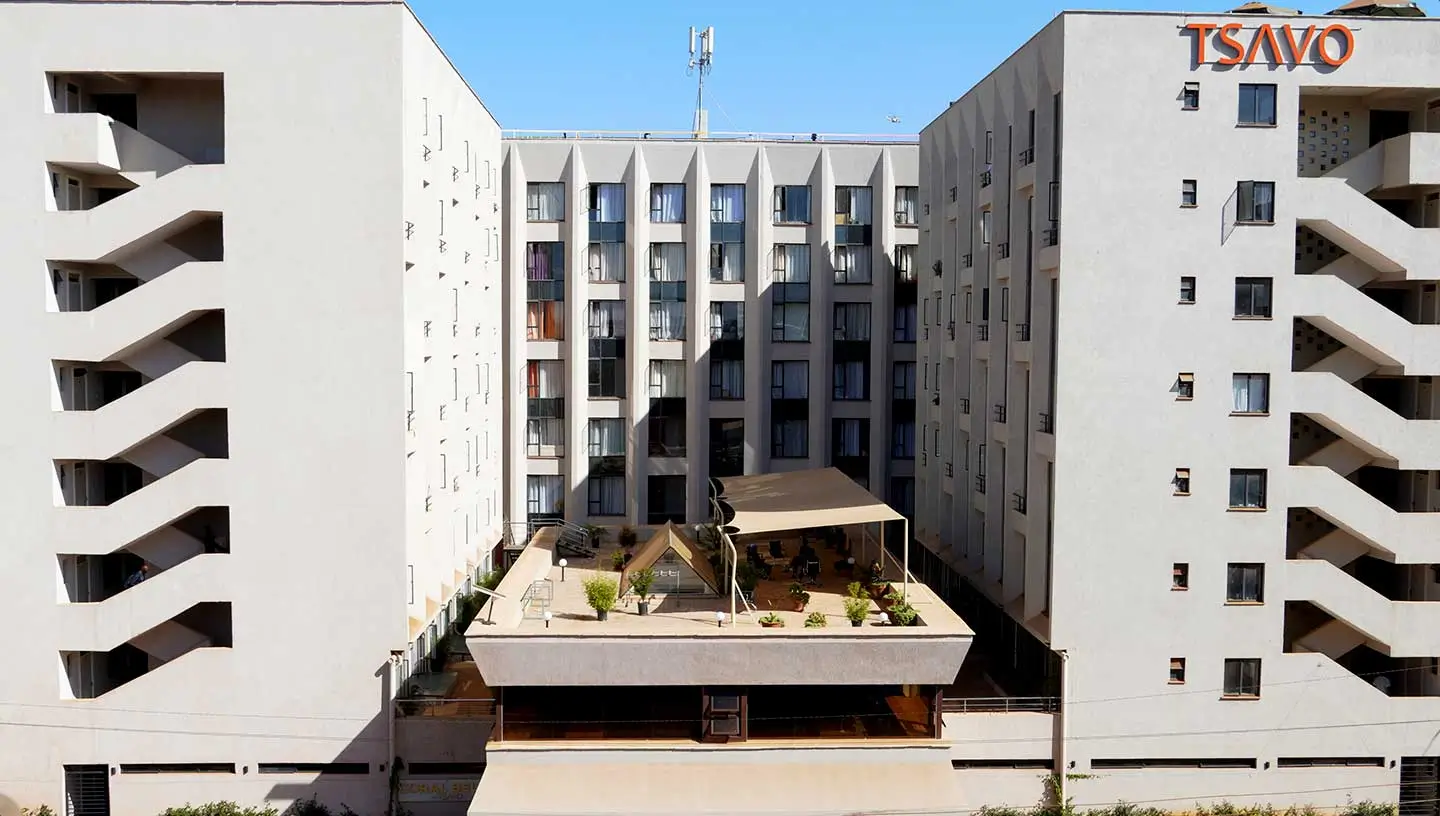 Modern apartment complex courtyard with landscaping and central plaza