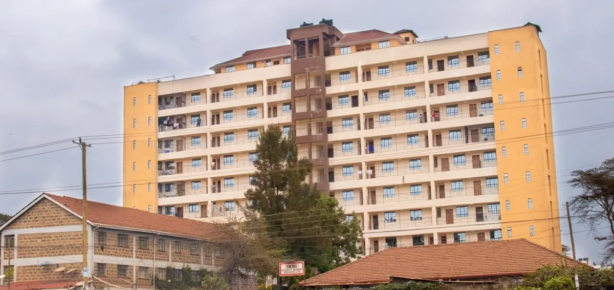 Multi-story residential apartment building with yellow facade
