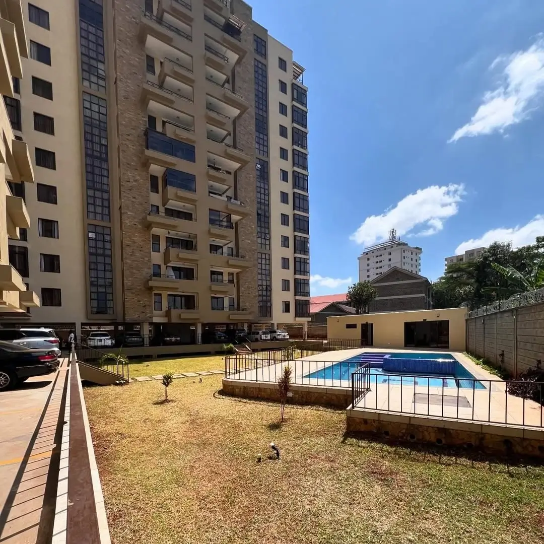 Compound grounds with pool, lawn, and residential buildings