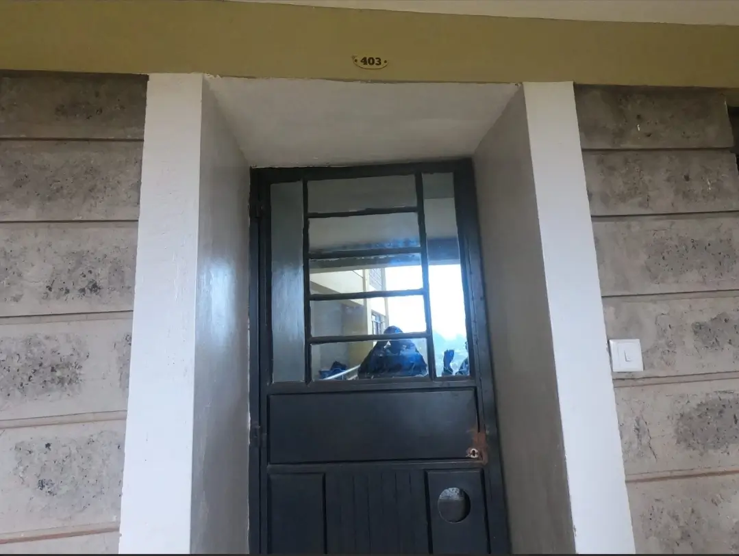 Building entrance lobby with black framed glass door