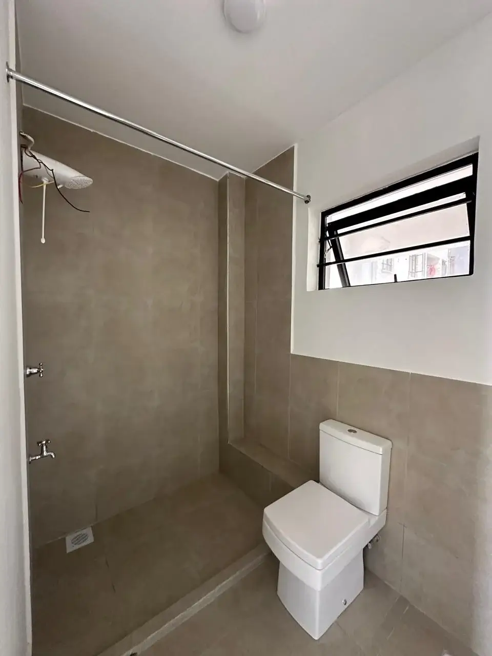 Modern bathroom with walk-in shower and toilet