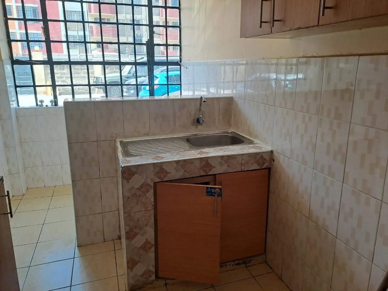 Dedicated laundry room with built-in sink and tile work
