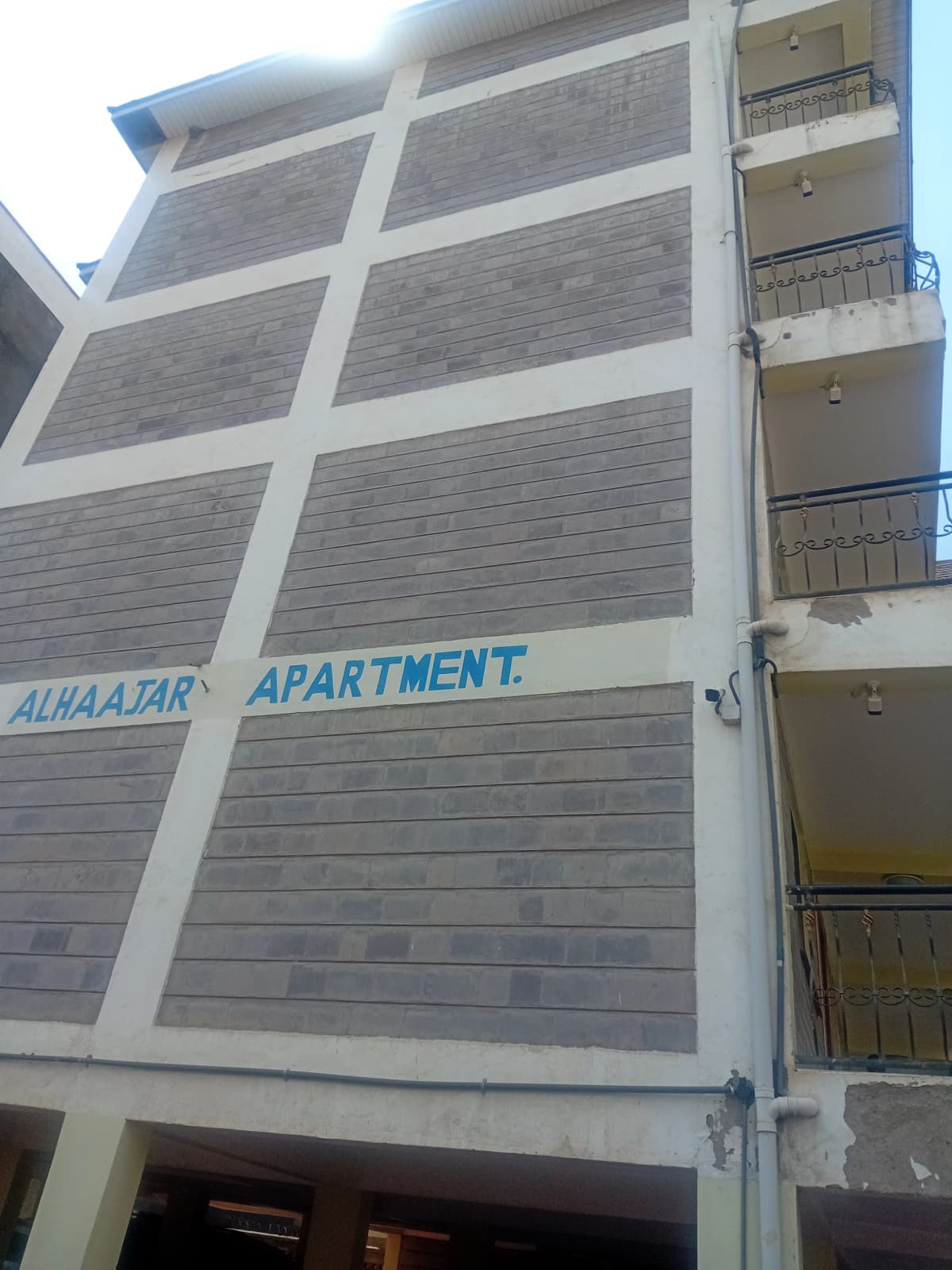 Multi-story apartment building facade with balconies