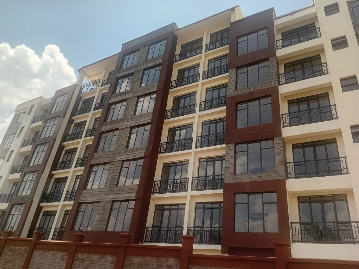 Modern multi-story residential building facade with balconies