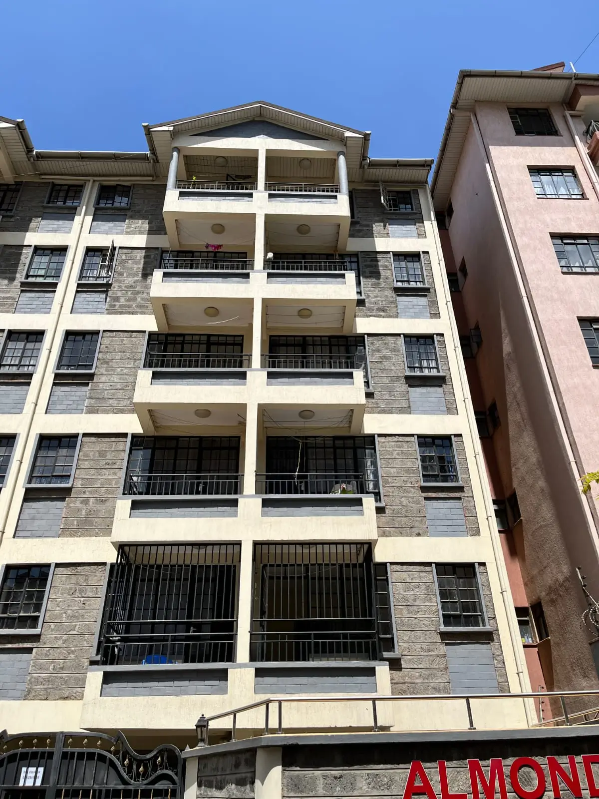 Modern multi-story residential building facade with balconies