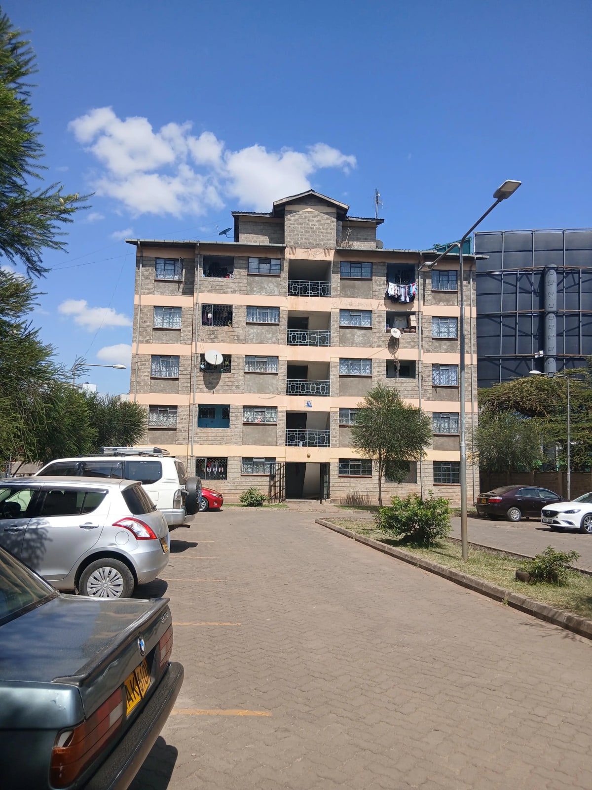 Multi-story residential building with ground-level parking area