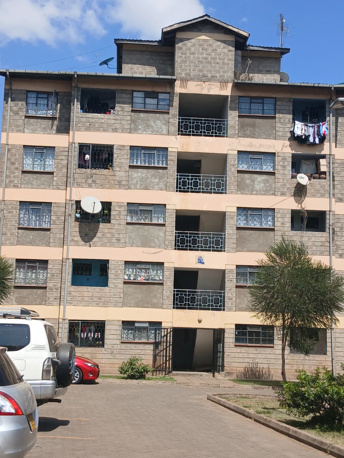 Multi-story residential apartment building with stone facade