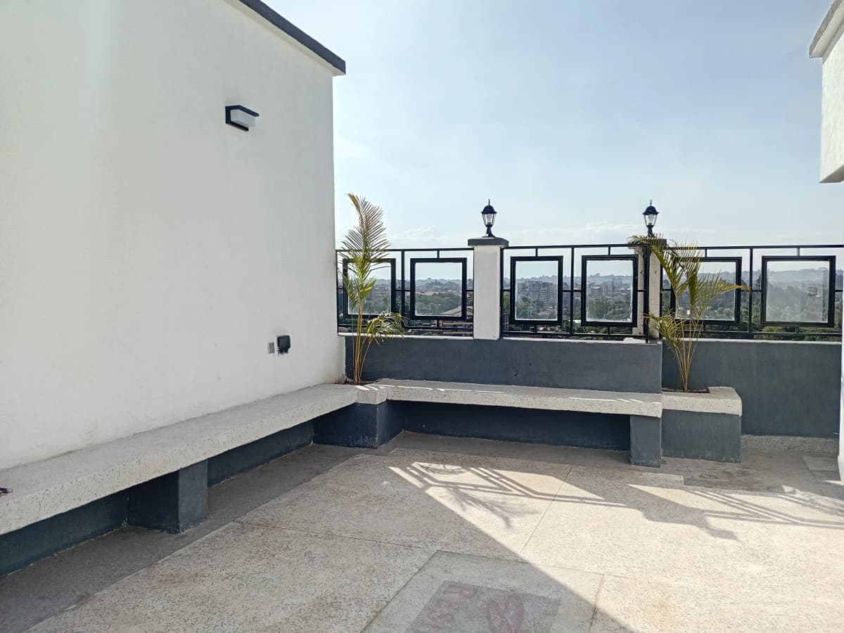 Rooftop terrace with built-in seating and city views