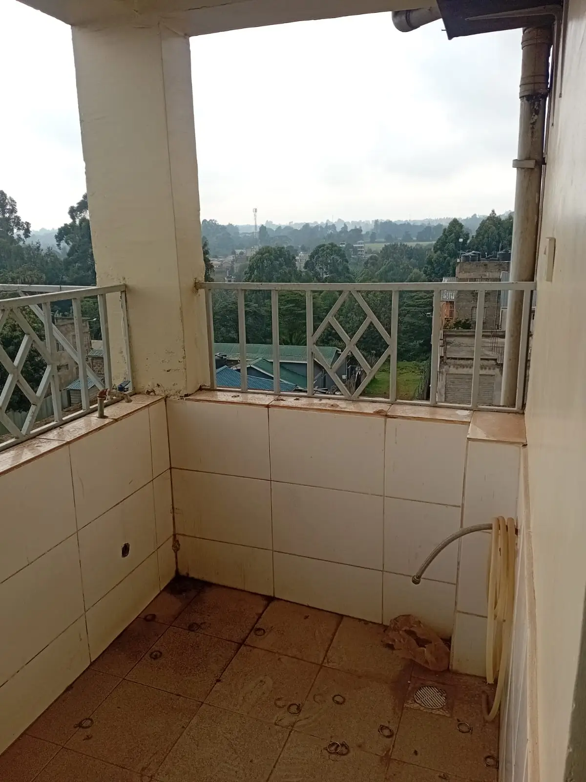 Balcony with lush green valley views and railing