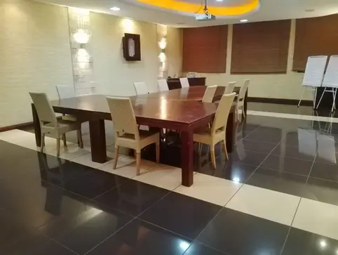 Formal dining room with wooden table and upholstered chairs