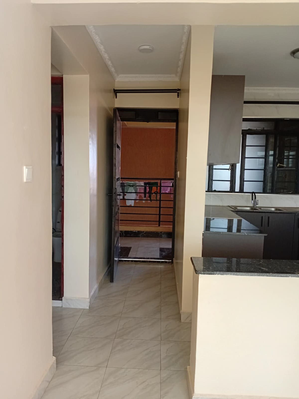 Modern hallway with kitchen visible on right side