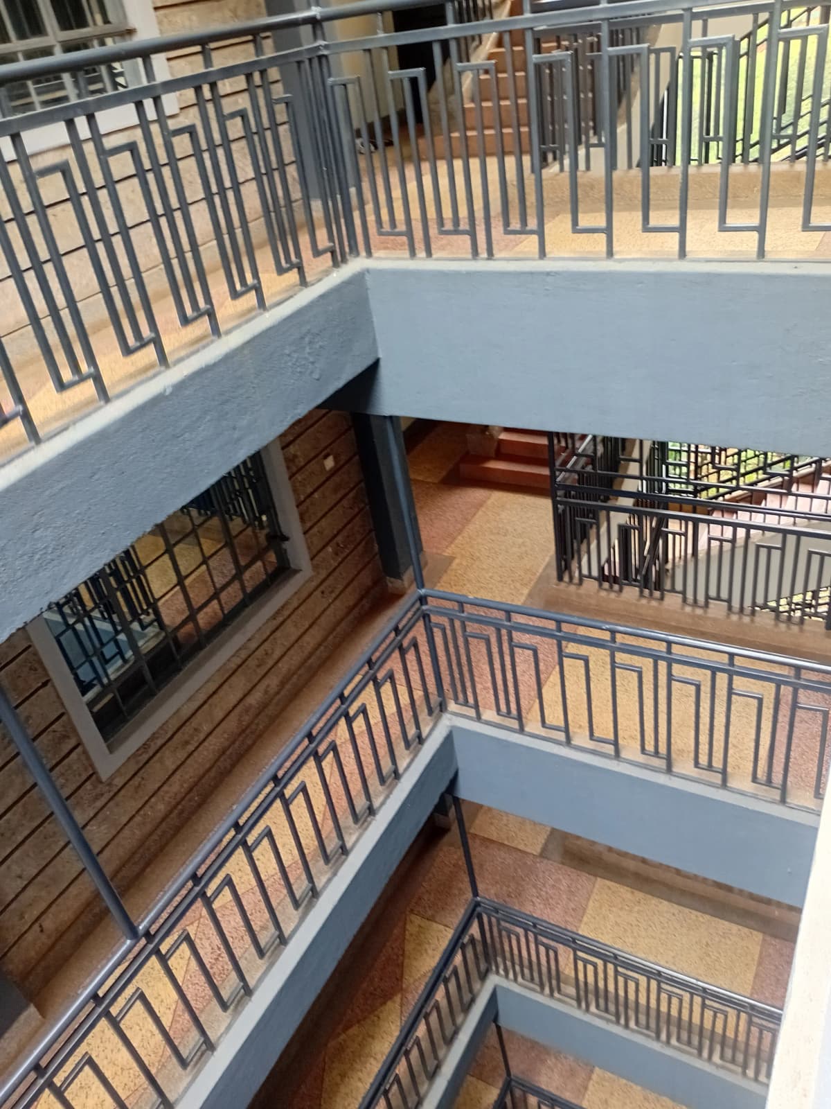 Multi-story building stairwell with metal railings