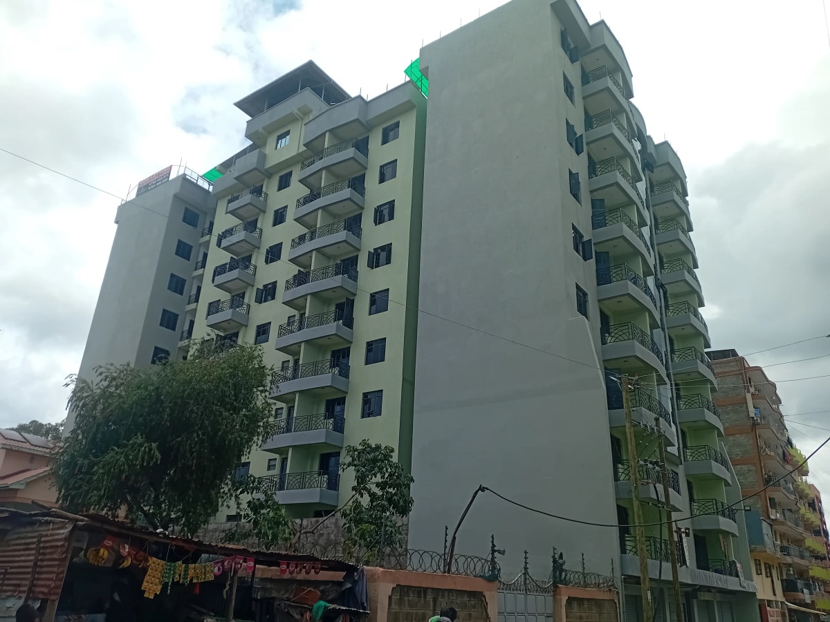 Multi-story residential apartment building facade with balconies