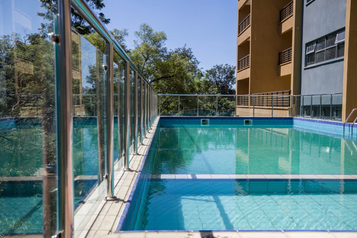 Olympic-length indoor swimming pool with glass partition walls