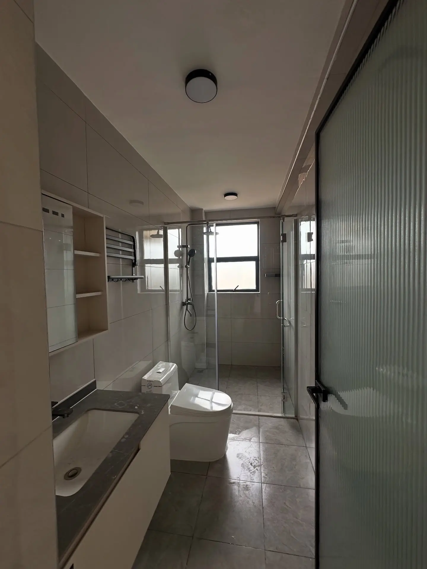 Modern bathroom with shower enclosure and ceramic fixtures