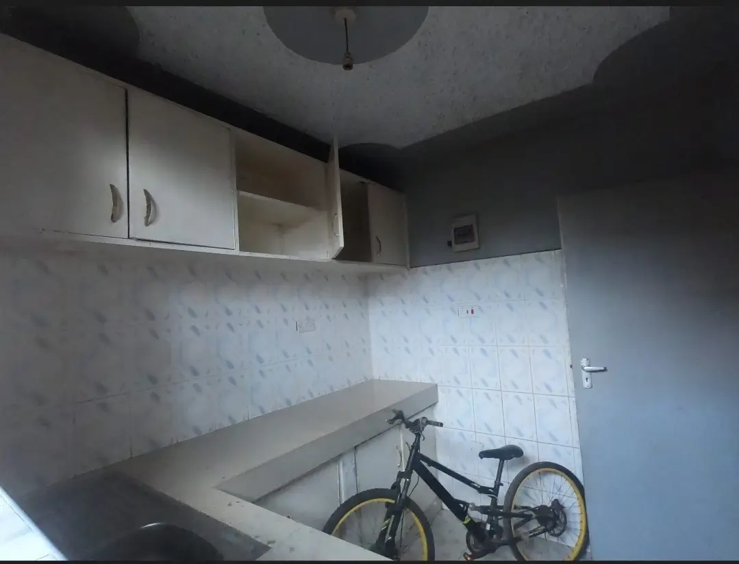 Utility room with countertop space and wall-mounted cabinets