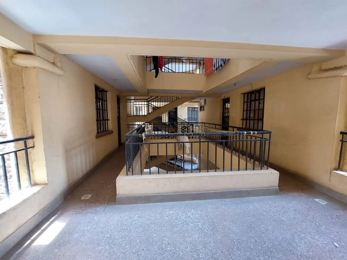 Multi-level lobby with staircase and metal railings