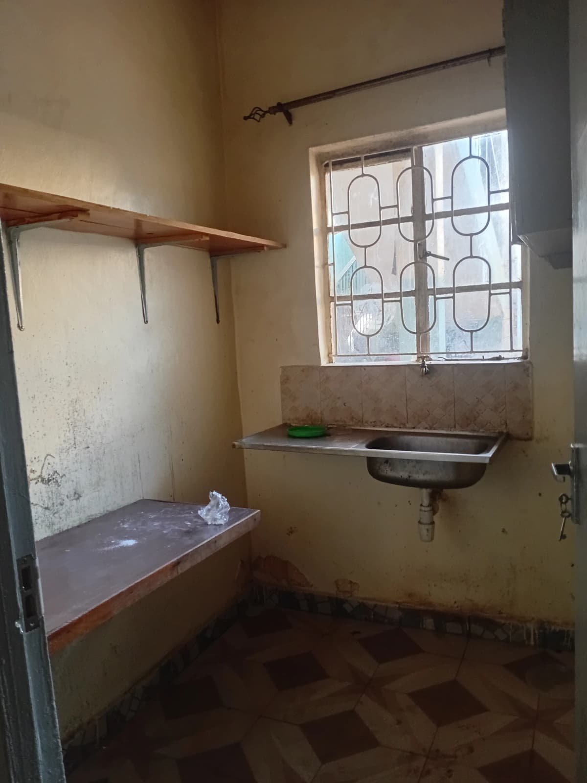 Utility room with sink, shelving, and washing station