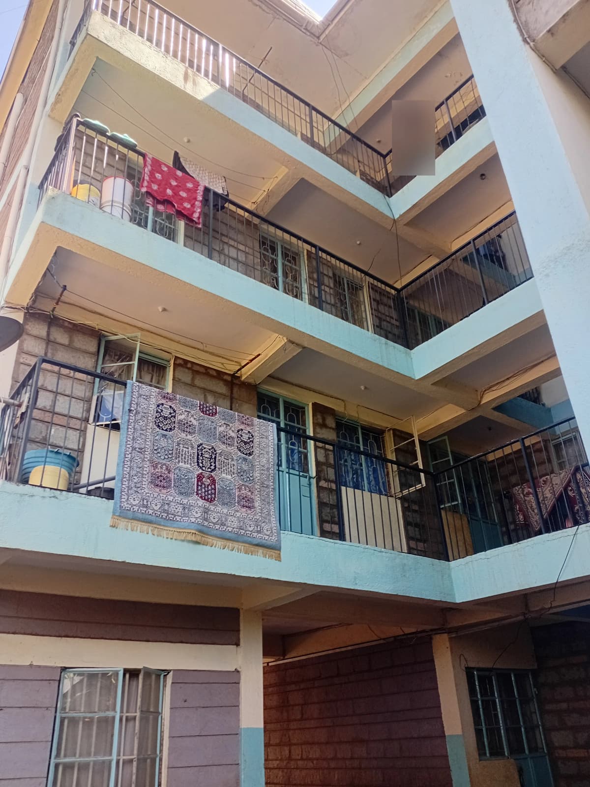 Multi-story interior atrium with stacked balconies and corridors