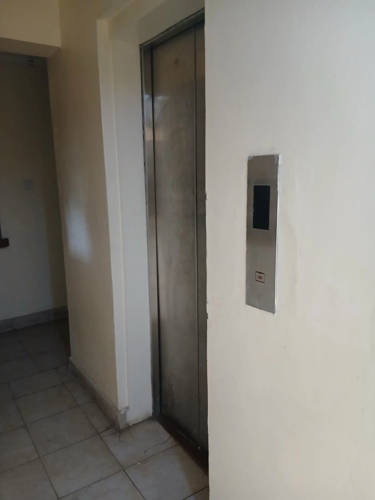 Building lobby with elevator and access panel
