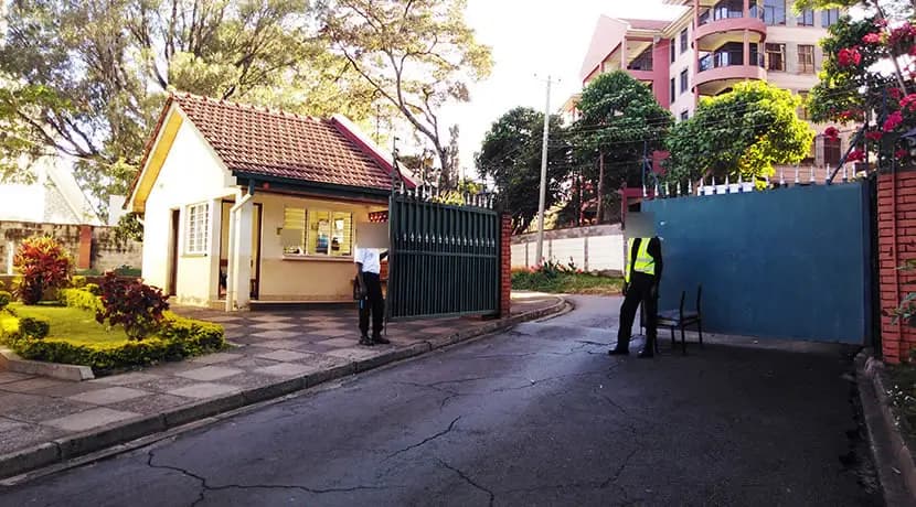 Compound entrance with security gate and guard house