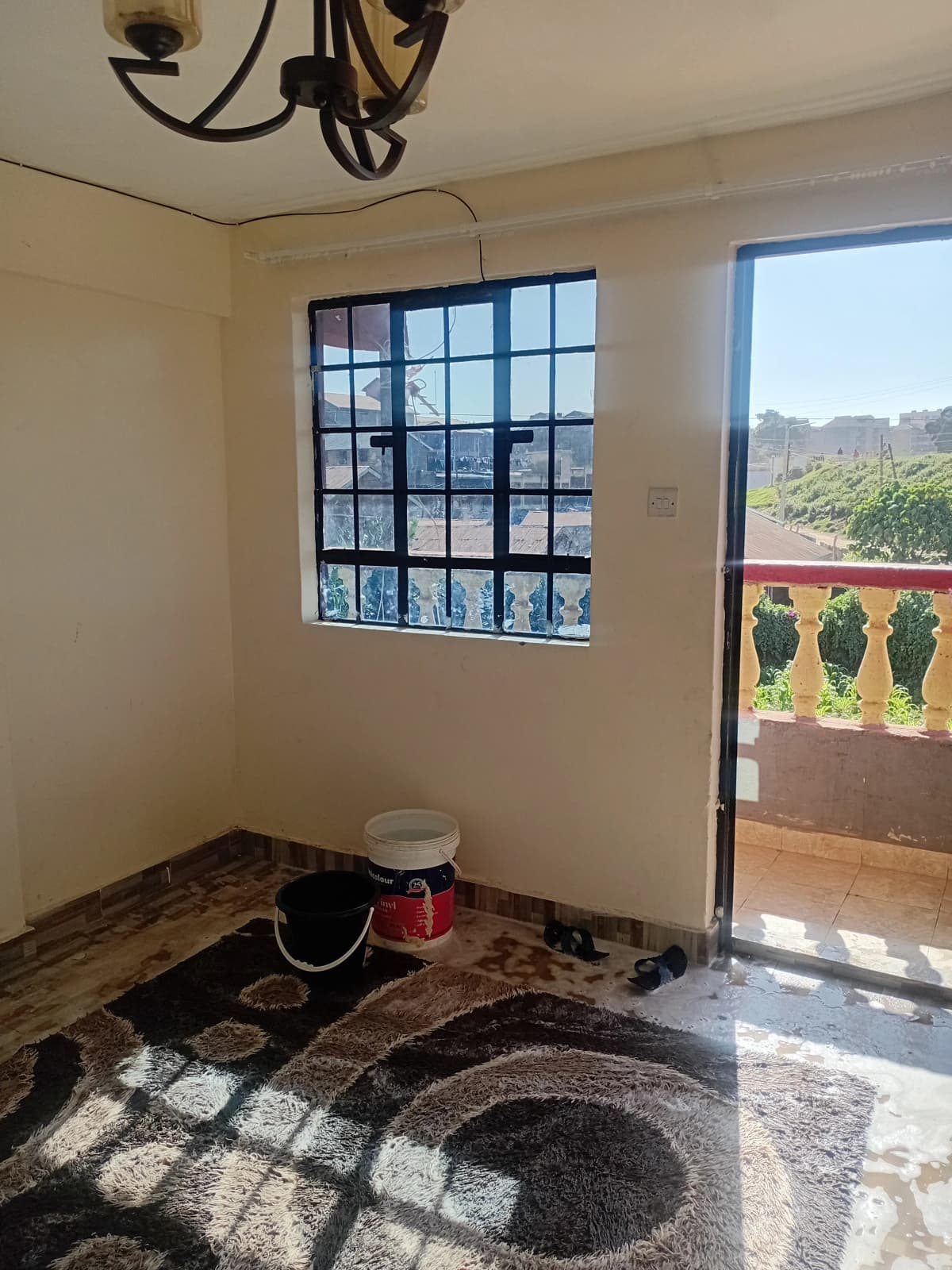 Bedroom with access to balcony overlooking green landscape