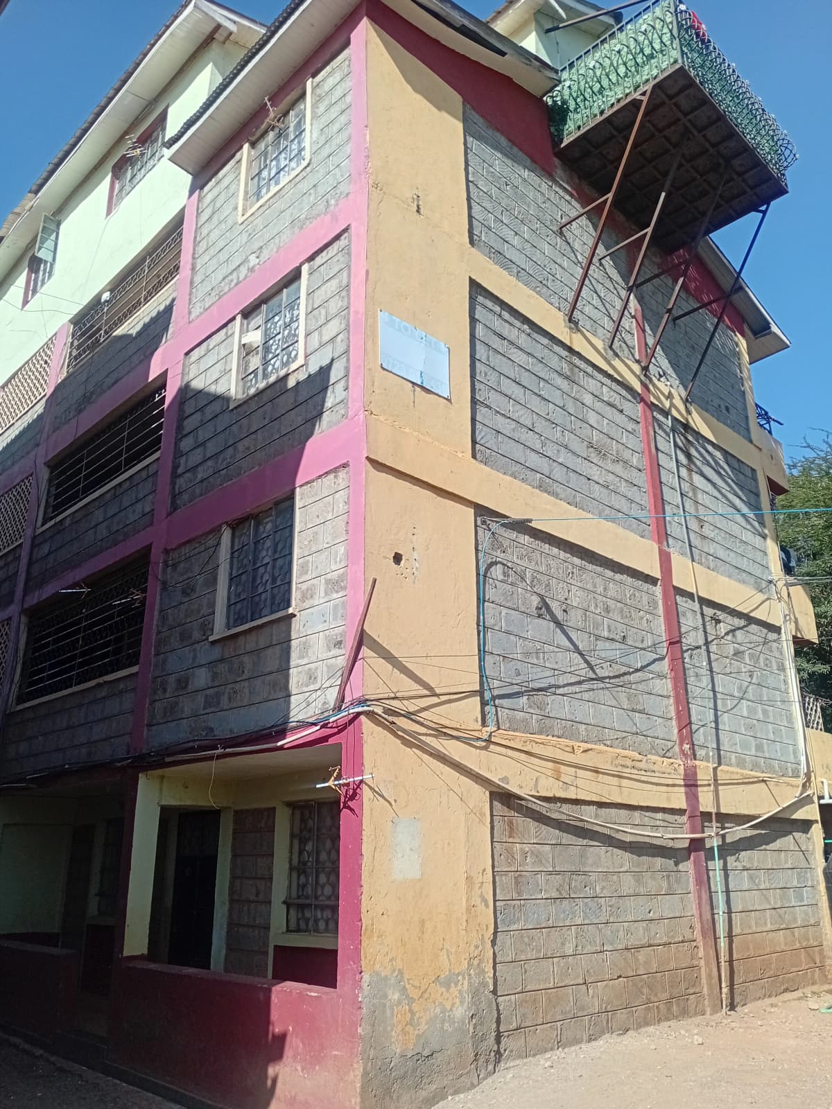 Multi-story residential building with colorful painted facade