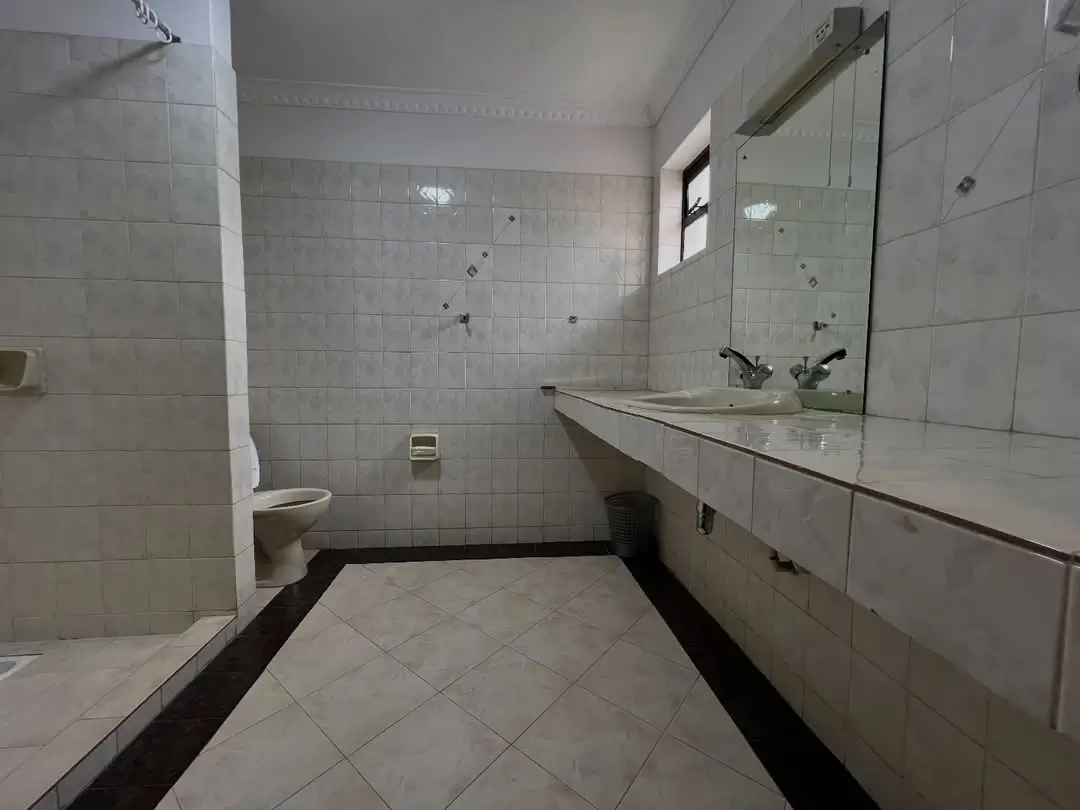 Spacious bathroom with double sink vanity and shower enclosure
