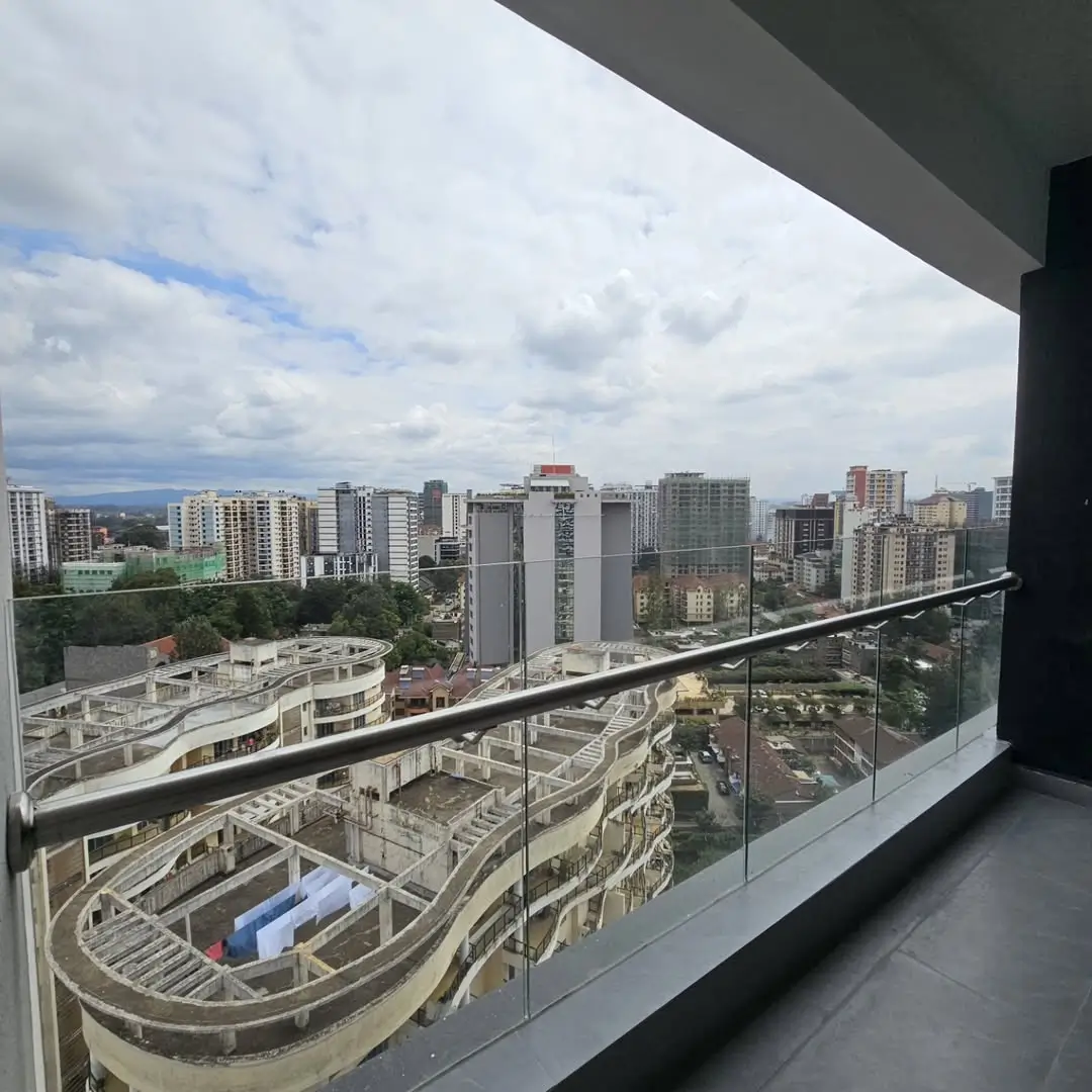 Panoramic cityscape view from high-rise balcony overlooking Nairobi