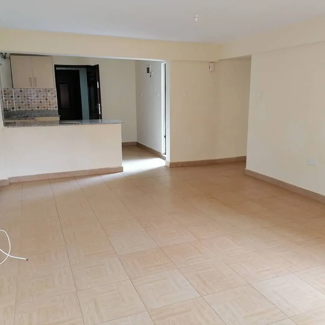 Open-plan living room with integrated kitchen counter area