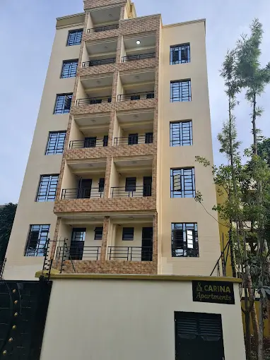 Multi-story residential building facade with balconies and windows