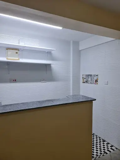 Modern kitchen with white subway tile and gray countertop