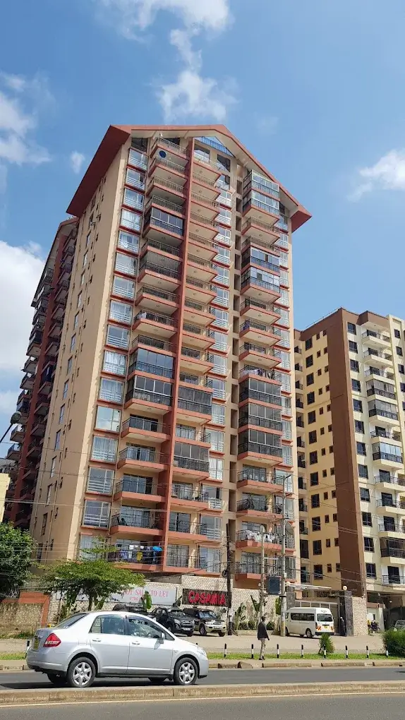 Multi-story residential apartment building facade with balconies