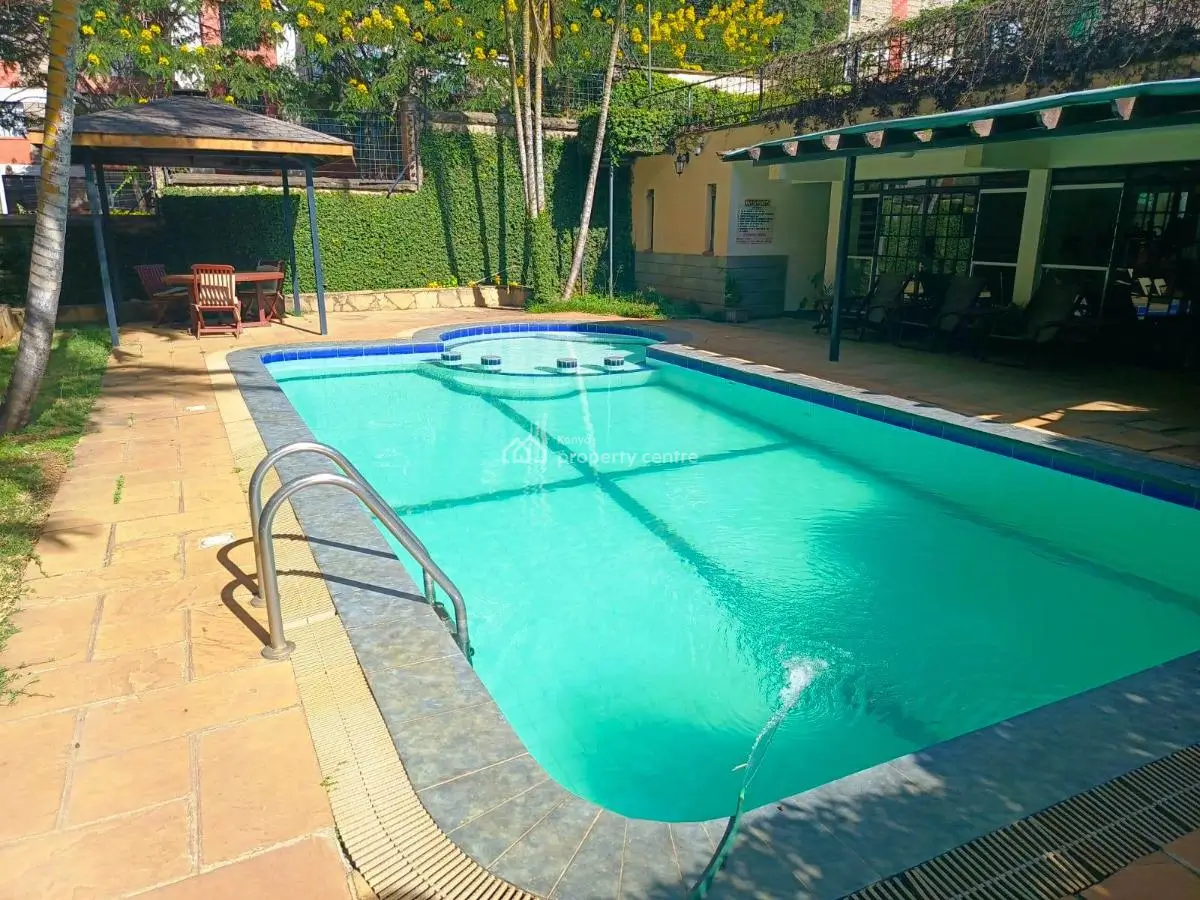 Rectangular swimming pool with turquoise water and loungers