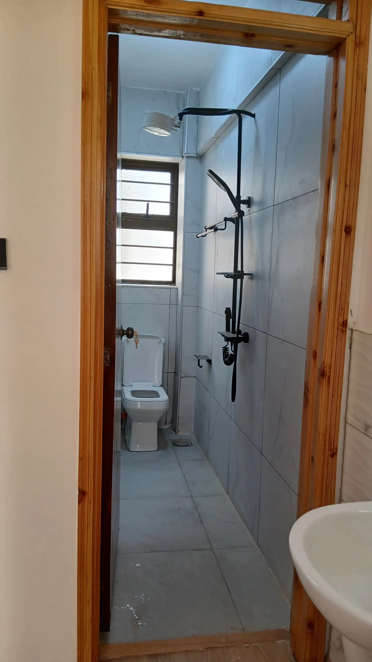 Modern bathroom with walk-in shower and toilet fixture