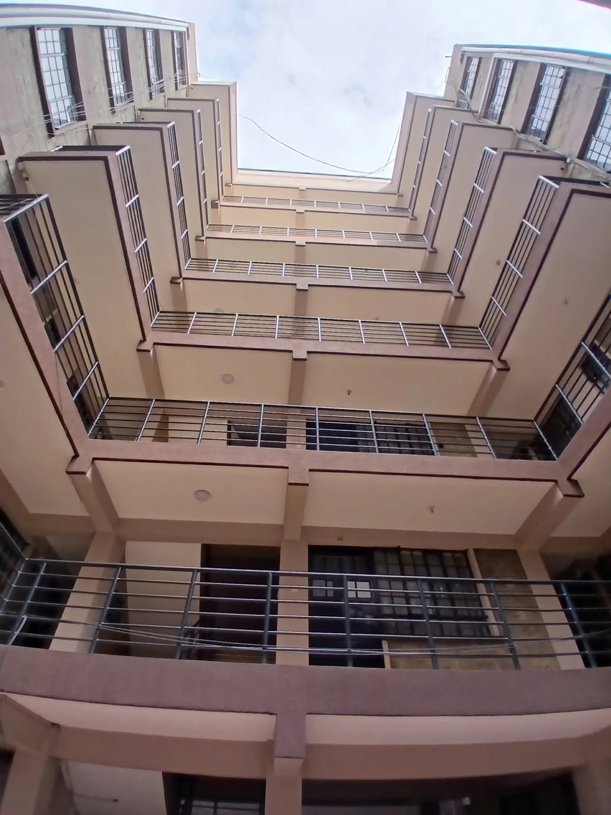 Multi-story residential building courtyard with balconies