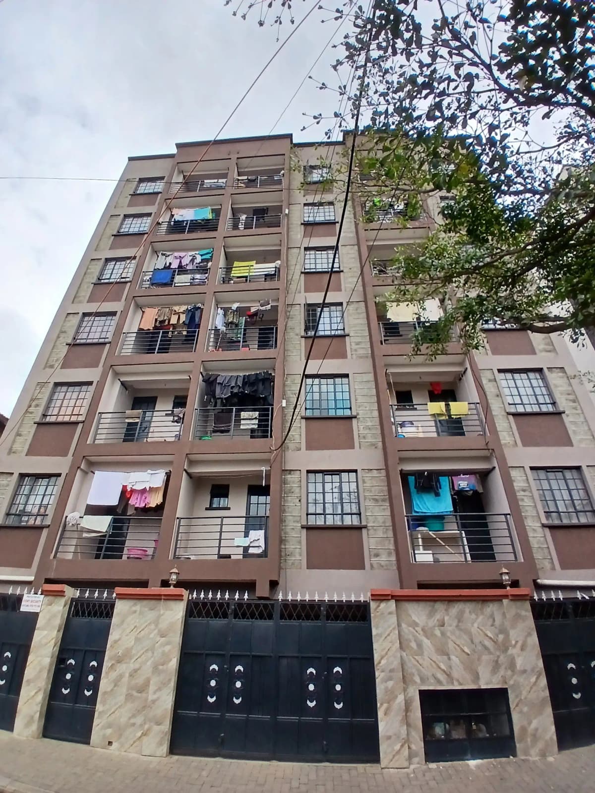 Multi-story residential building facade with commercial ground floor