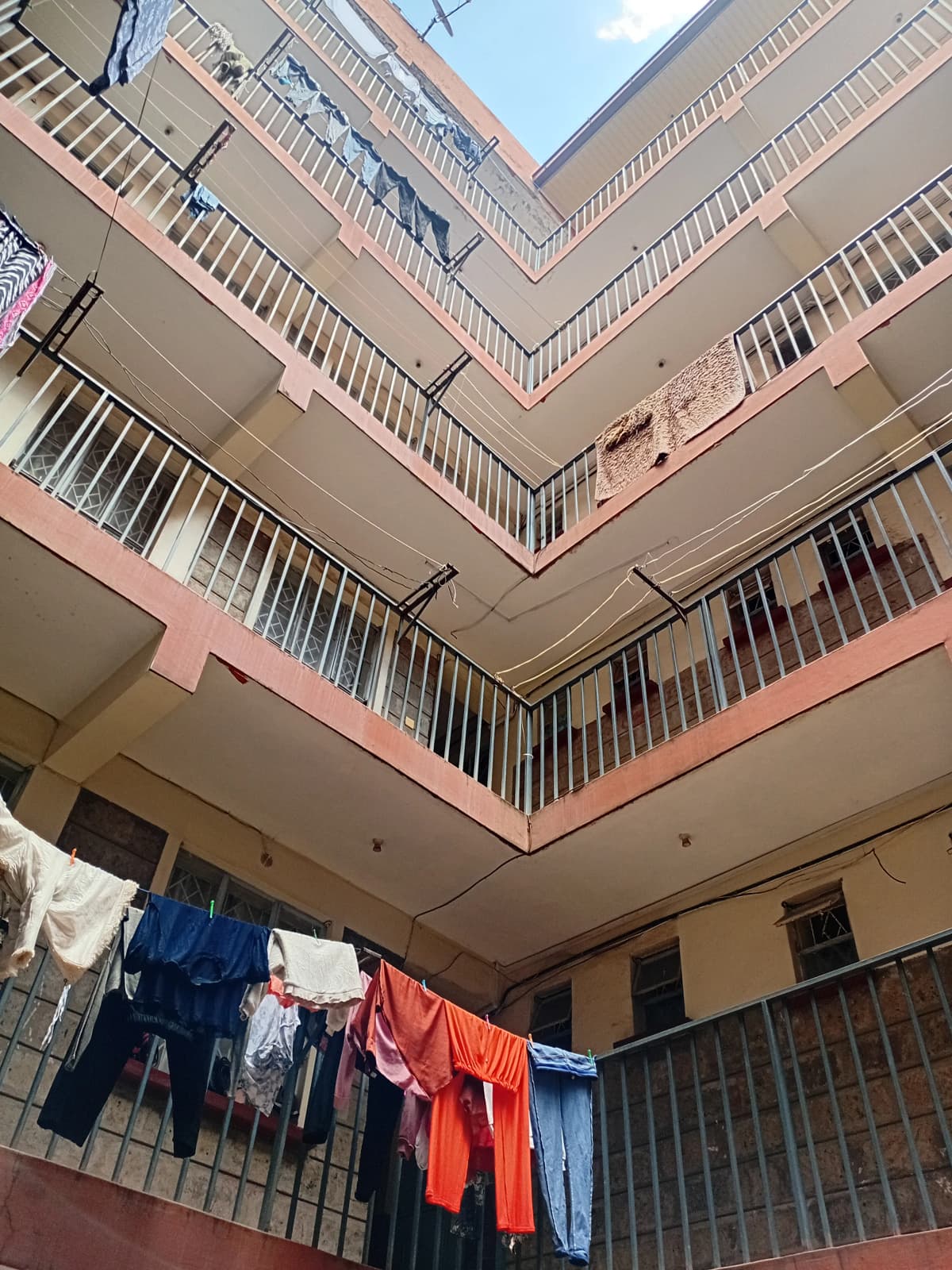 Multi-story residential building courtyard with balconies