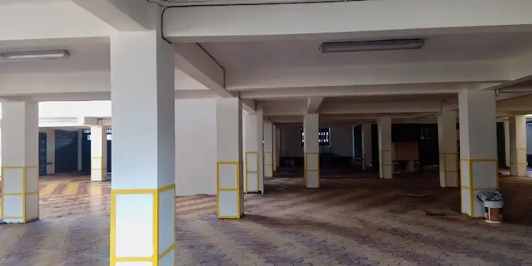 Multi-level basement parking with yellow safety pillars