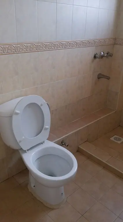 Basic bathroom with toilet and shower area