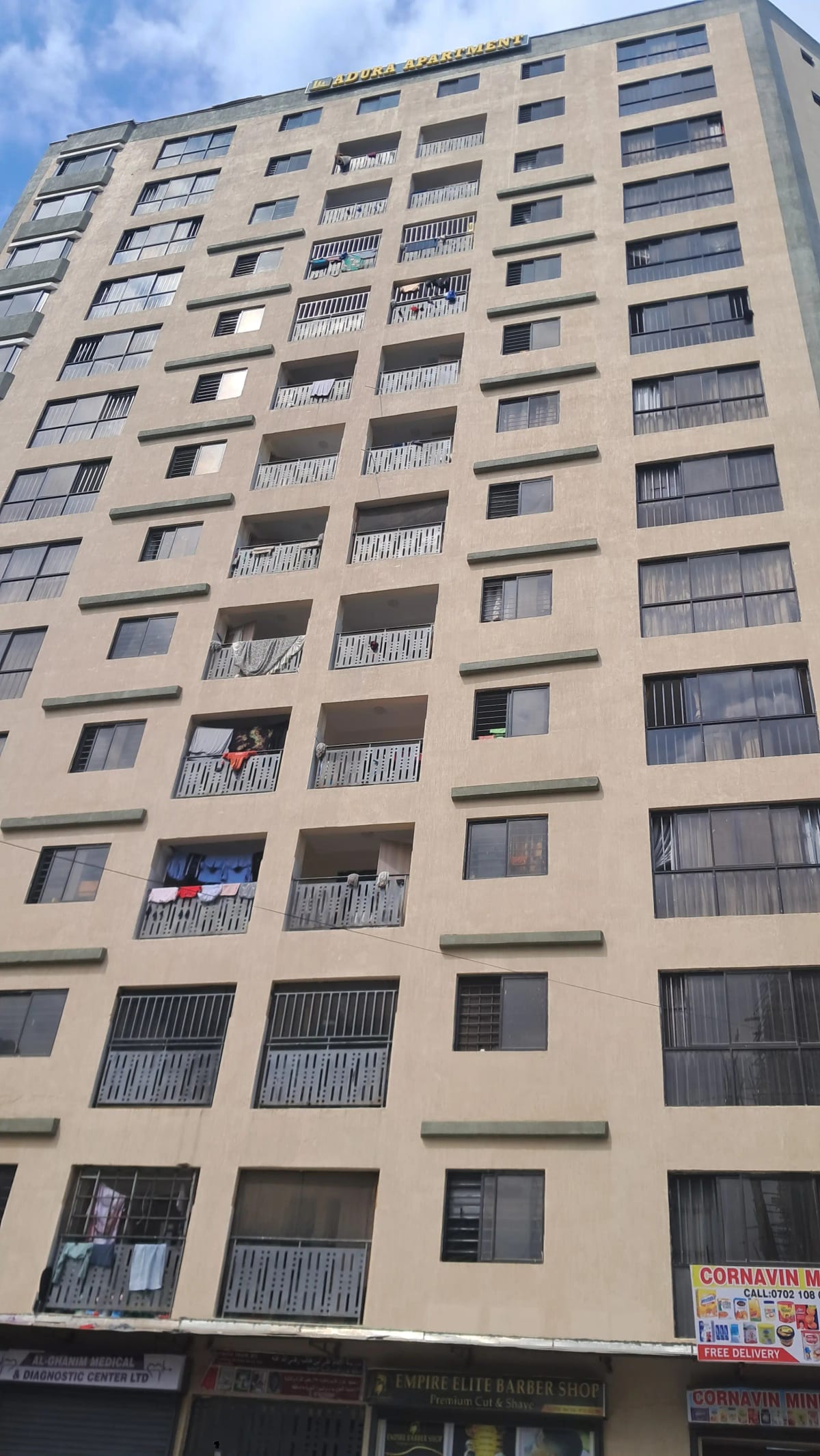 Multi-story residential apartment building facade with balconies