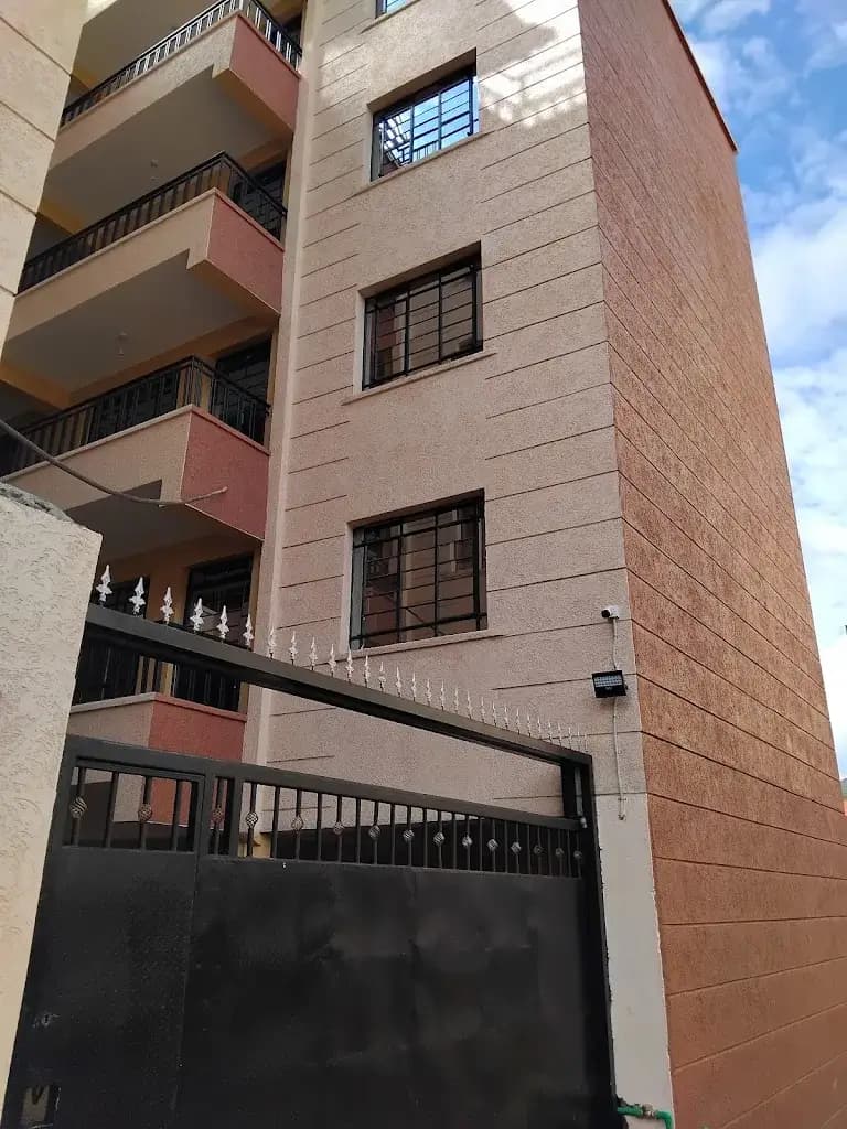 Multi-story residential building with brick facade and balconies