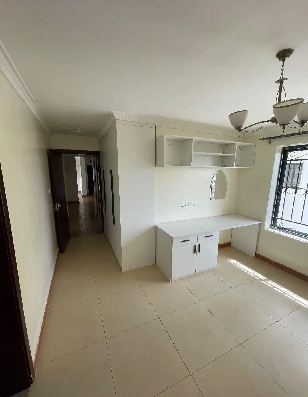 Open-plan living area with integrated kitchen counter and storage
