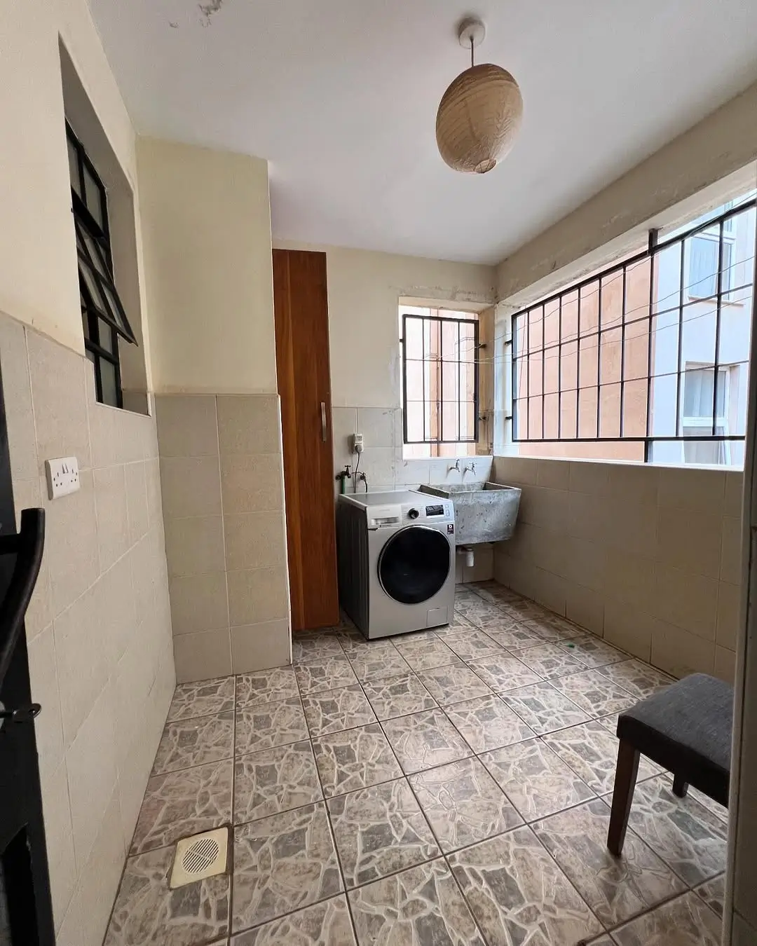 Laundry room with washing machine and sink