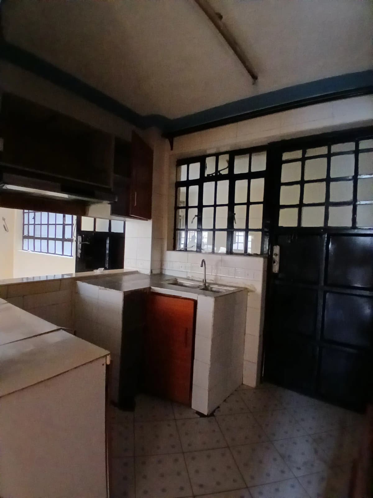 Open-plan kitchen with island counter and dining area